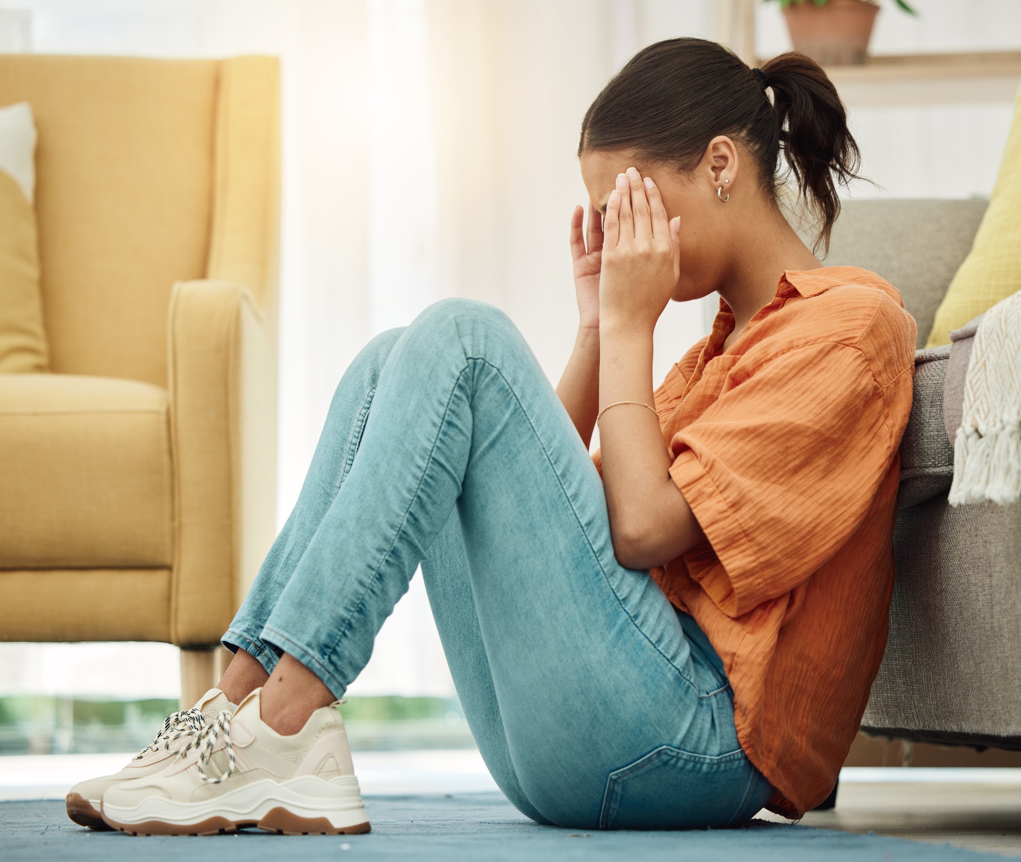 headache woman and stress on floor of home with anxiety depression and ptsd of trauma sad girl c